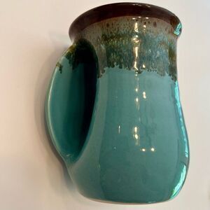 CLAY IN MOTION Hand-Warmer Pottery Mug Left